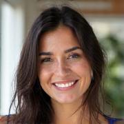 Portrait of Aisha, an energetic Vinyasa Flow Yoga instructor